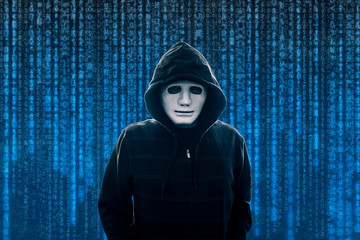 Hooded computer hacker with white mask