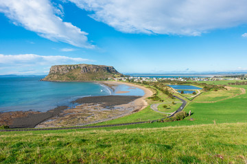 Beautiful landscape view of the nut -- remains of an ancient volcanic plug, and the historic village of Stanley. Tasmania, Australia. Scenery of mountain and village by sea over vast farmland. - obrazy, fototapety, plakaty