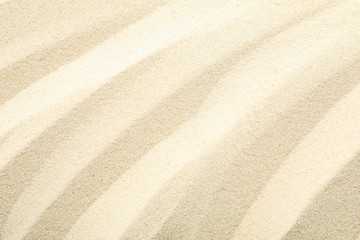 Fototapeta na wymiar Clear sea sand as background, space for text and closeup. Summer vacation background