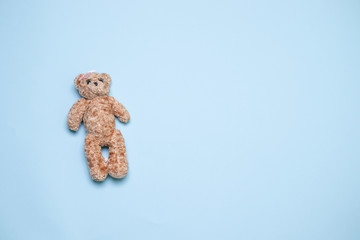 Bear toy over blue background with copy space top view, flat lay