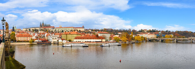 Fototapeta na wymiar river,europe,old,town,architecture,city,travel,sky,summer,cityscape,tower,tourist,tourism,castle,history,medieval,blue,day,prague,vltava river,looking at view,scenics - nature,city life,urban skyline,