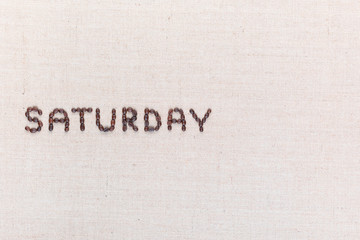 The word Saturday written with coffee beans , aligned to the left.