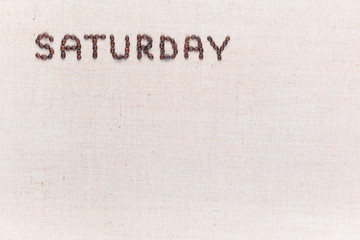 The word Saturday written with coffee beans , aligned at the top left.
