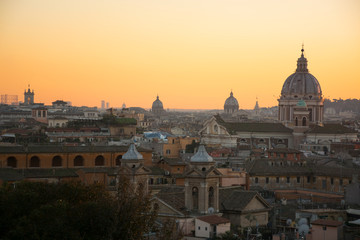 Fototapeta na wymiar Panorama of Rome from Pincian Hill at sunset, Villa Borghese. Domes and roof tops of eternal city