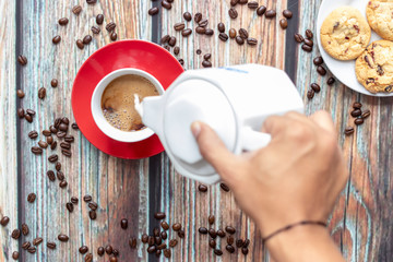 Serving milk coffee at breakfast