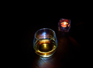 Obraz premium Glasses and candle on the table