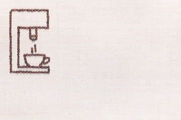 A coffee machine preparing a coffee all made from coffee beans, aligned at the top left.