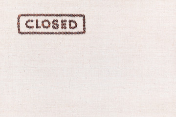 The word Closed inside a rectangle written with coffee beans,aligned at the top left.