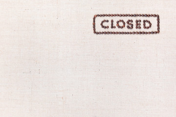The word Closed inside a rectangle written with coffee beans,aligned at the top right.