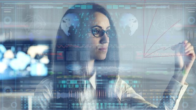 The woman drawing on the glass on the hologram background