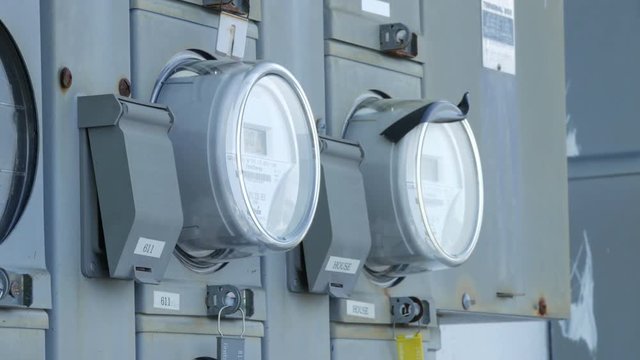 Close up of 2 electric meters for building