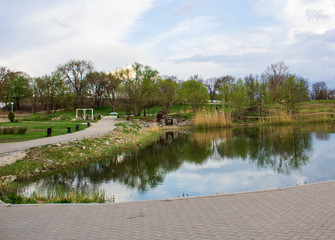  Beautiful park in spring and unidentified people in the park.