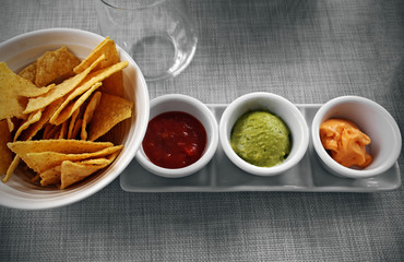 Snack of nachos and sauces
