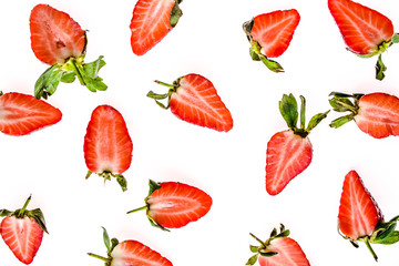 Fresh fruit pattern with strawberries, top view. Slices of strawberry isolated on white background.