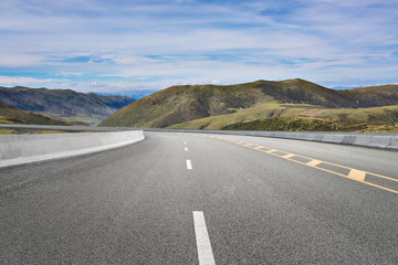 Empty highways and distant mountains