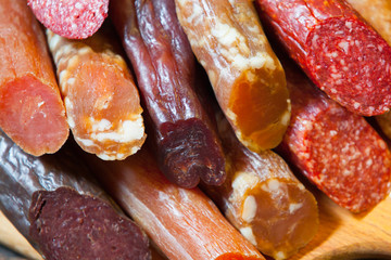 an assortment of dry sausage.