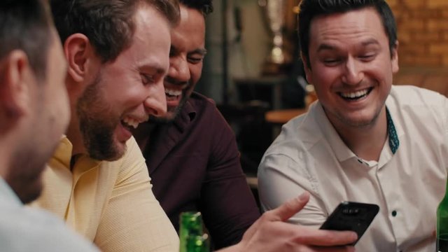 Friends talking about casual things in the pub