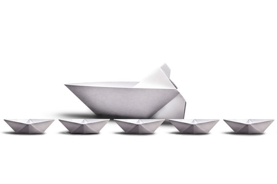 Handmade paper boats, image for corporate environment with concept leadership team nade.