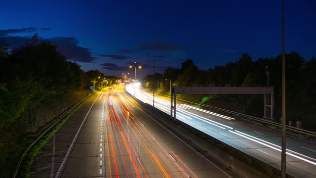 car lights at rush hour on an motorway junction, traffic timelapse