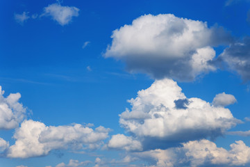 Naklejka na ściany i meble Beautiful blue sky with white clouds as a natural background.