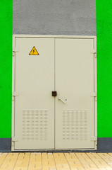 Iron gray door of a transformer box.