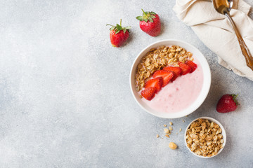 Homemade yogurt with fresh strawberries and muesli. The concept of a healthy Breakfast. Copy space.