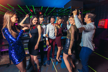 Group of friends partying in a nightclub