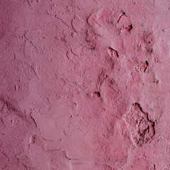 Abstract grunge texture - old battered wall with potholes.