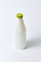 Mock-up dairy bottle from plastic on a light background.
