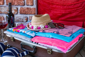 Suitcase preparation for a summer holiday , Retro , vintage and old luggage   
