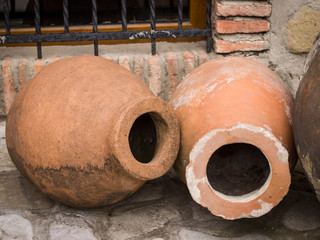 Qvevri, a large earthenware vessel originally from Georgia, Caucasus. It is used for the fermentation and storage of wine, often buried below ground level or set into the floors of wine cellars.