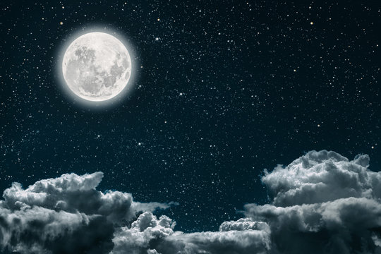 a backgrounds night sky with stars and moon and clouds.