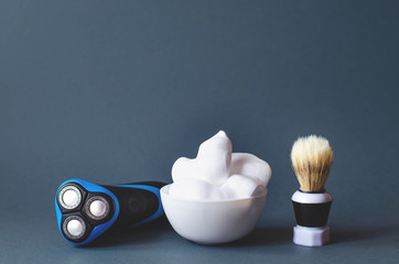 Men's accessories for shaving on a gray background.