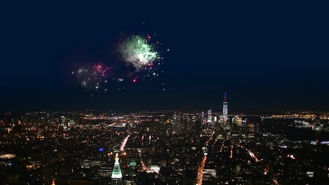 Night view with fireworks of Manhattan in New York City.
