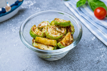 fried sliced zucchini on grey concrete
