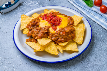 nachos chili con carne on plate