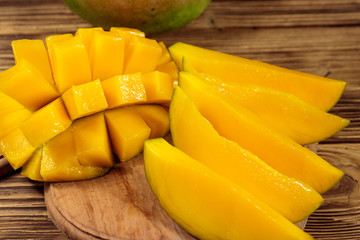 Fresh mango fruit on wooden table
