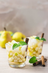 Festive pear kombucha cocktail. Selective focus, space for text.