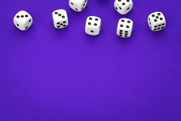 White dices against a blue background