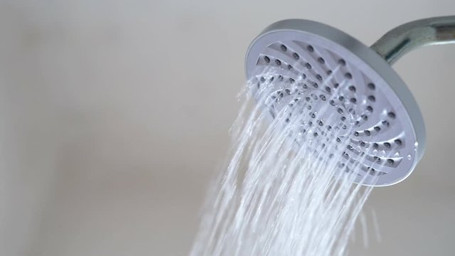 Slow Motion footage - water flowing from shower head. Concept of hygiene and save water. Full HD MP4