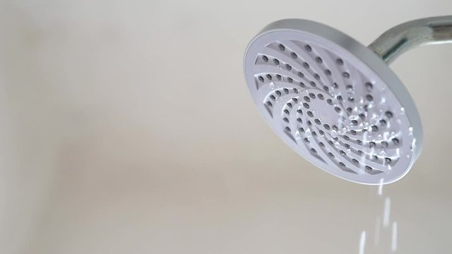 Slow Motion footage - Water flowing from a leaking shower head. Concept of save water and water waste. Full HD MP4
