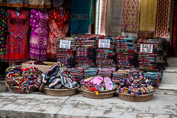 Woolen handmade traditional winter cloths outside the shop for sale at mall road, manali. Local street baazar market - Image