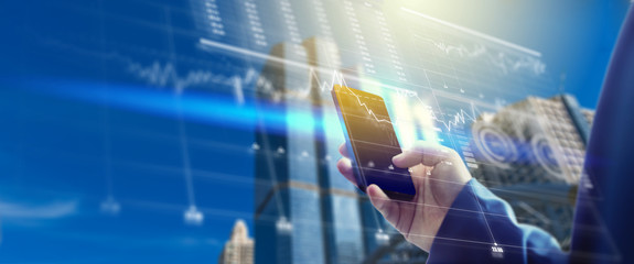 Business man use mobile phone for Finance and network. business hologram future concept.
