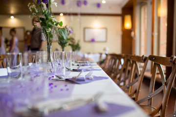Elegant table setup in purple pastels for a restaurant wedding