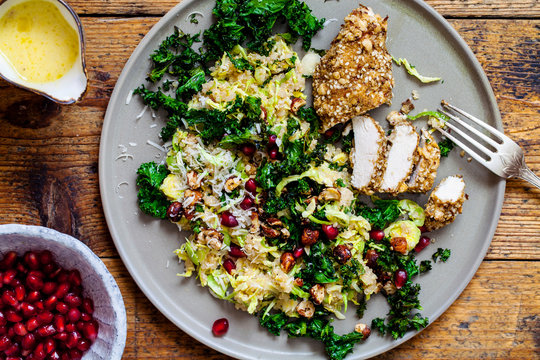 Quinoa, brussel sprouts, crispy kale and hazelnuts salad with dukkah crusted chicken 