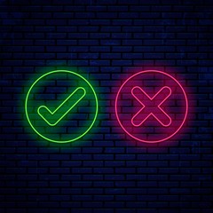 Bright neon sign, check marks, icons round shape isolated on wall background. Neon green check mark and red cross. Accept and reject. Right and wrong.