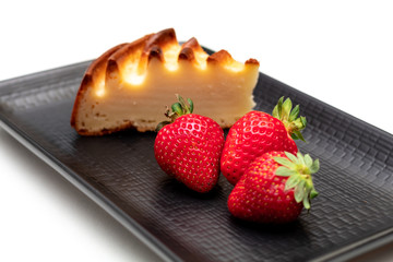 homemade cheese cake with strawberry on plate ready to eat