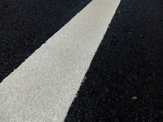 Road traffic paint White on the asphalt surface