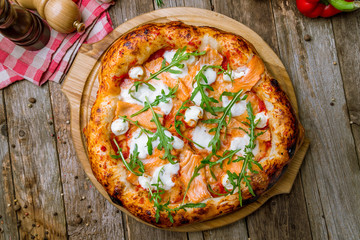 Pizza with salmon and Philadelphia cheese