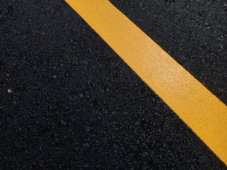 Road traffic paint Yellow on the asphalt surface